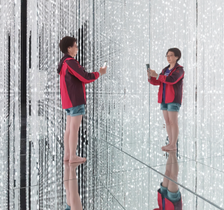 Tourist taking a photo of herself at TeamLab Planets