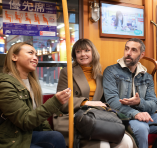 Tourists with a private guide on a bus, Japan