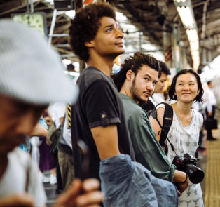 Tourists waiting to board the train, Japan