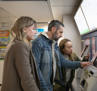 Tourists booking their train tickets, Japan