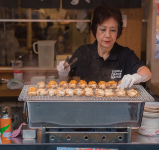 Amazing lady cooking some traditional Japanese food, Ja