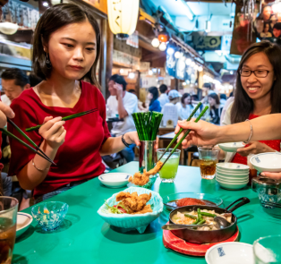 Travelers enjoying traditional Japanese food