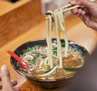 Cooked ramen in a thick broth