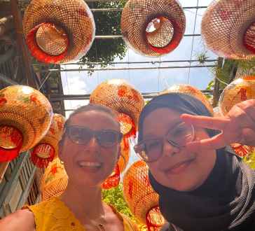 Joyful Smiles Under Vibrant Lanterns