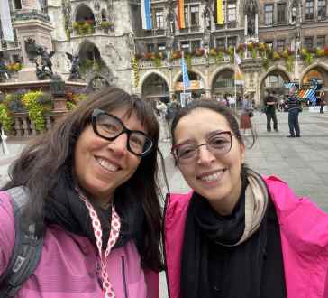 Smiles bloom against the historic backdrop of Munich's Marienplatz.
