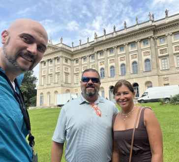 Capturing Moments in Front of a Majestic Estate