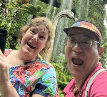 Delighted Wanderers Amidst Waterfalls