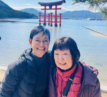 Smiles by the Historic Torii Gate