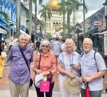 Joyful stroll past Singapore's vibrant streets and iconic mosque.