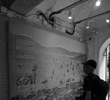 Pausing to explore Hong Kong's captivating maritime history through a vintage map.