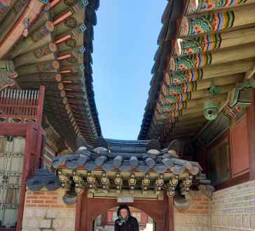 Exploring intricate architecture under Seoul's vibrant skies.