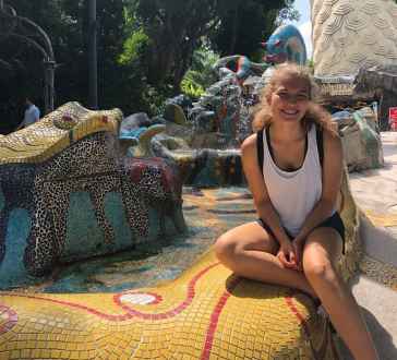 Sunlit Smiles Amid Mosaic Wonders