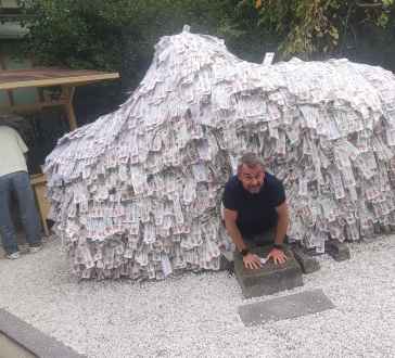 Exploring a unique paper sculpture in a Kyoto courtyard.
