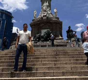 Guardian of Triumph: A Moment Beneath the Angel