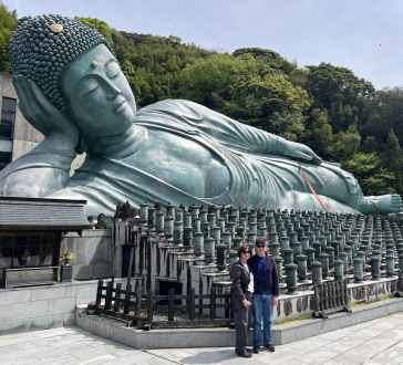 Large bronze sculpture of a reclining Buddha at Nanzo-in Temple, Sasaguri, Japan.