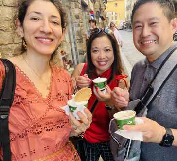 Savoring afternoon gelato on a charming street in Florence.