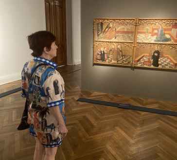 Admiring intricate medieval art in a quiet Santiago gallery.