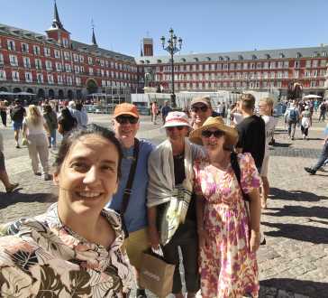 Sunlit Smiles in Madrid's Majestic Plaza