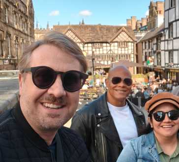 Sunlit Smiles in a Timeless Town Square