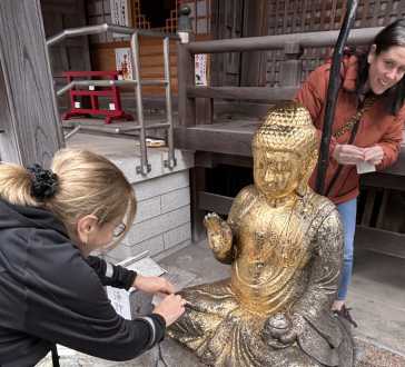 Golden Reverence: A Moment at the Shrine