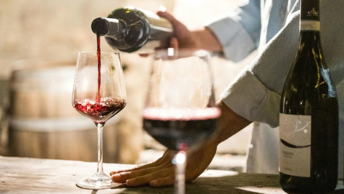 bottle,alcoholic drink,alcohol,drinkware,barware,wine,glass bottle,liquid,wine bottle,dessert wine,red wine,liquor,stemware,wine glass,glass,champagne glass,wine tasting