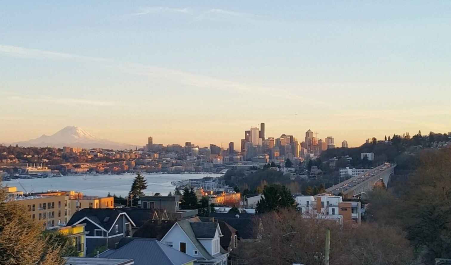 Seattle skyline with Mount Rainier in the background during sunset.