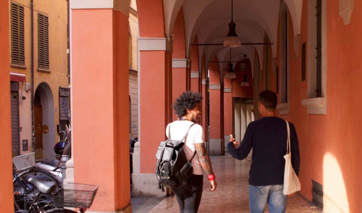 Timeless Discussions in a Charming Corridor in Bologna's University