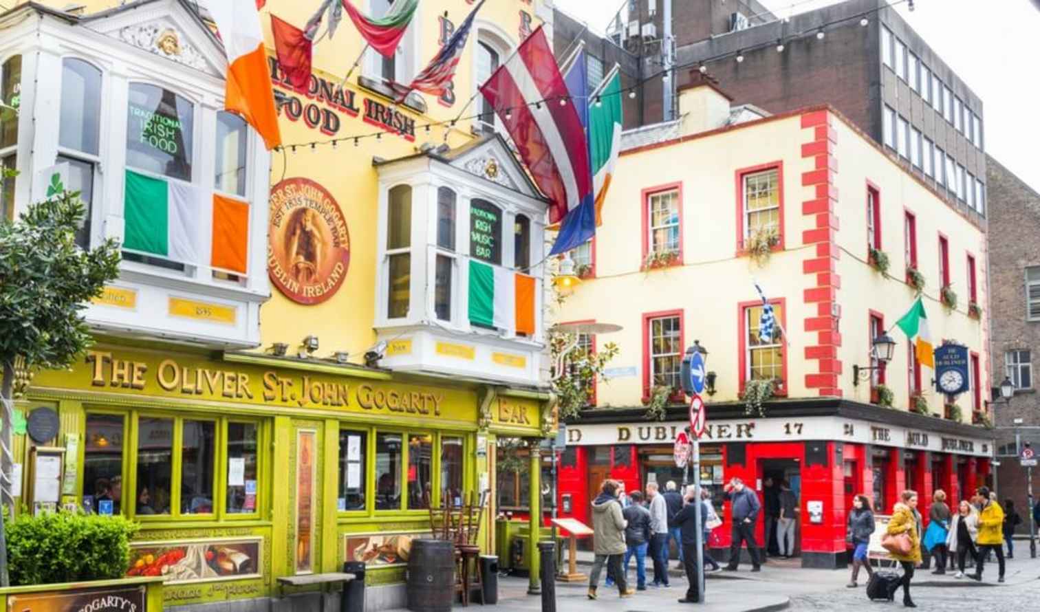 People walking past The Oliver St. John Gogarty in Dublin.