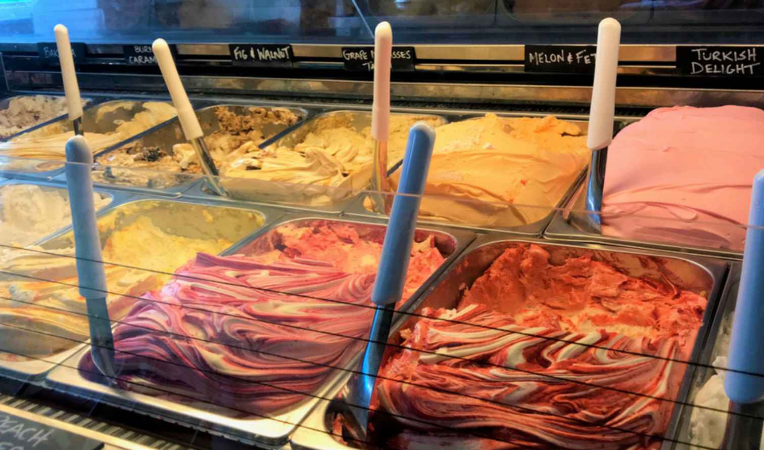 Variety of gelato flavors labeled at Sydney's Gelato Messina store.