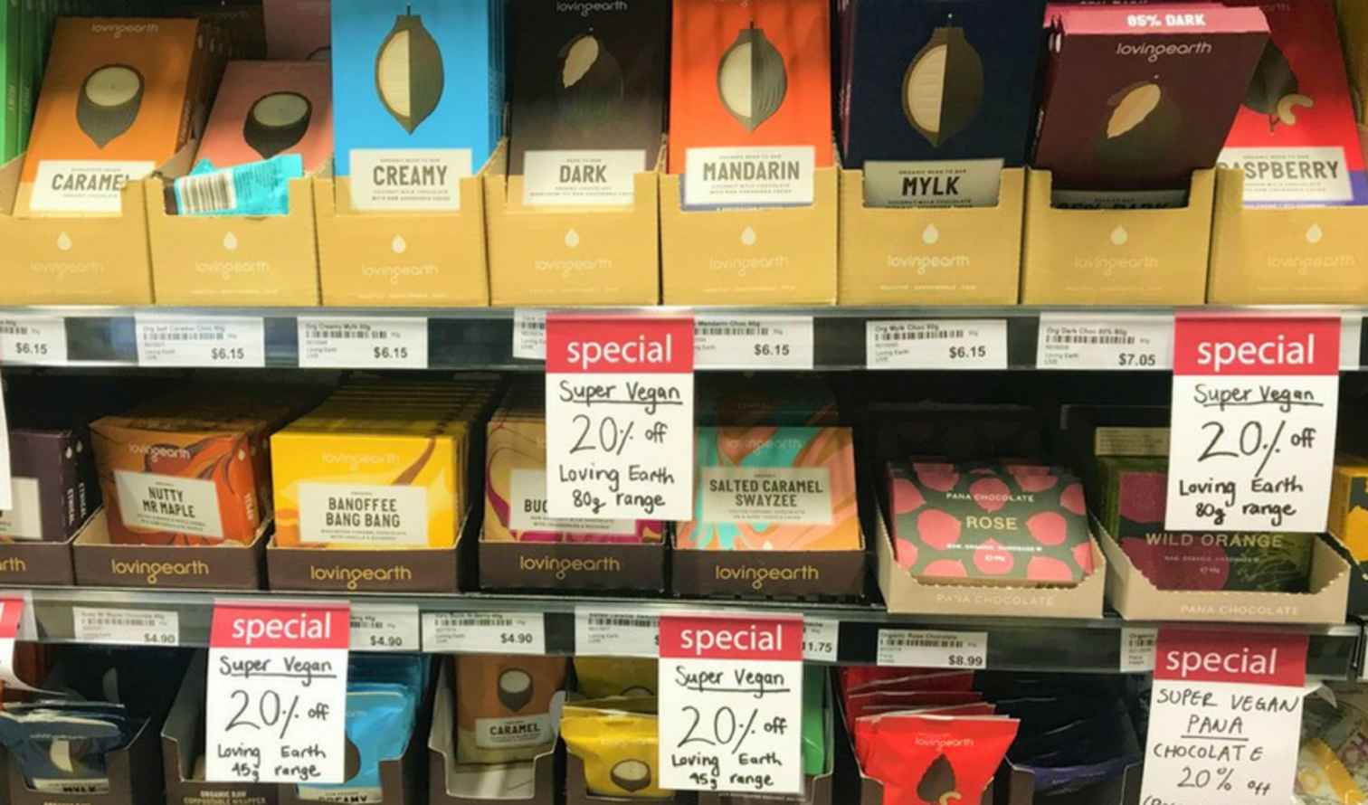 Display of Loving Earth chocolate bars with various flavors on a store shelf in Sydney