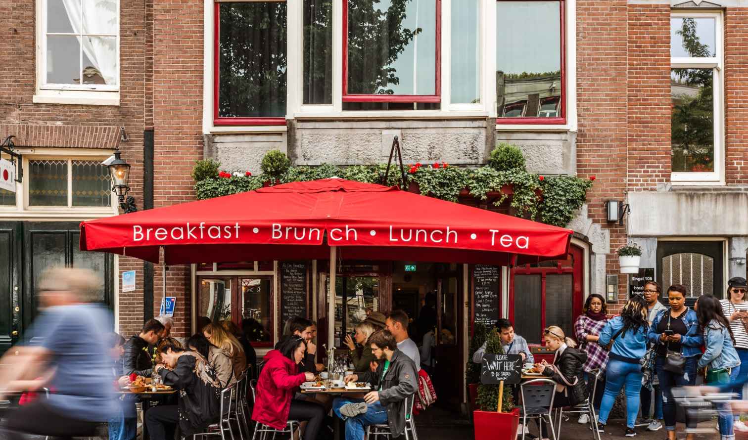 Cafe with red awning on Singel street, Amsterdam.