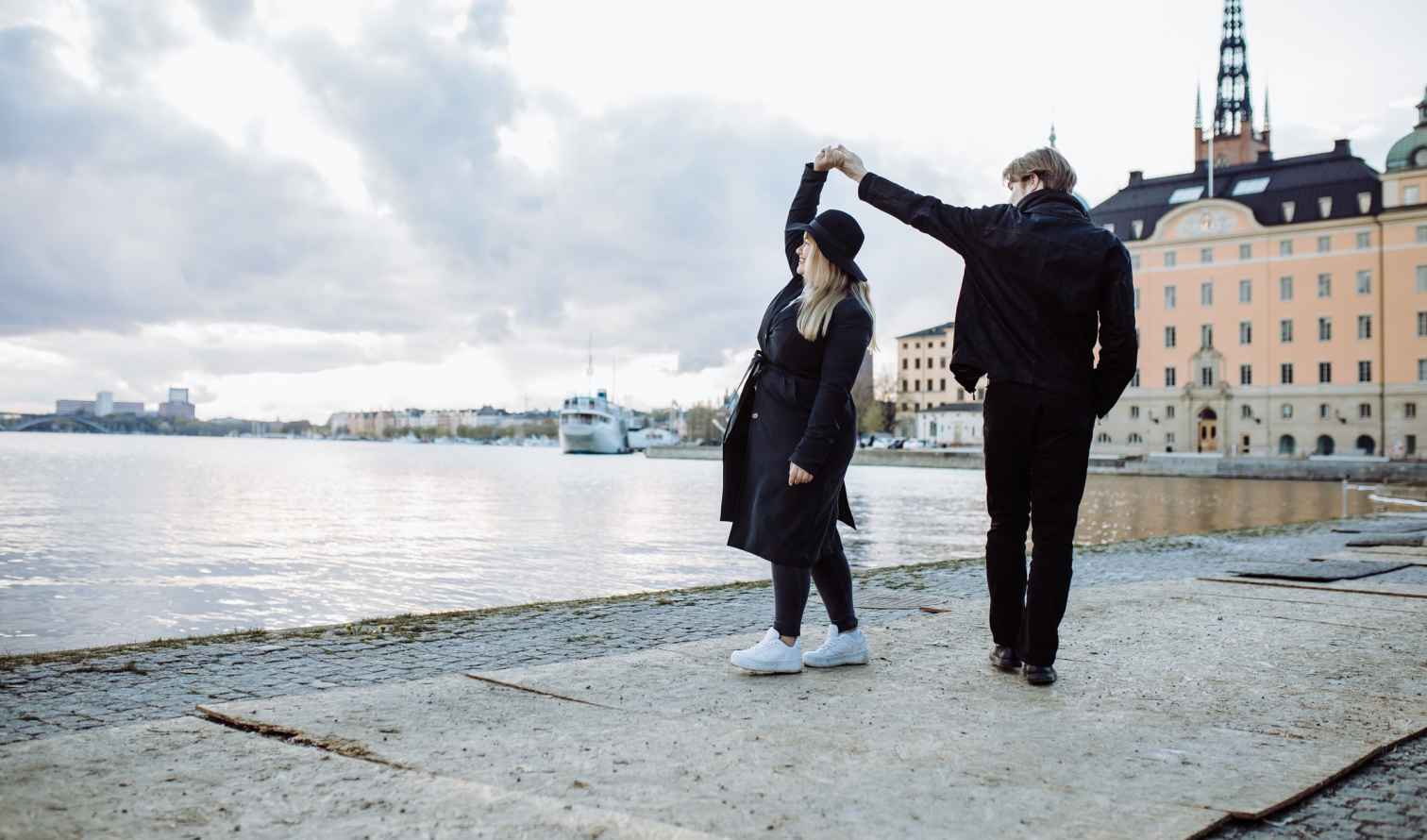 Two people dancing near the waterfront in Stockholm, Sweden.