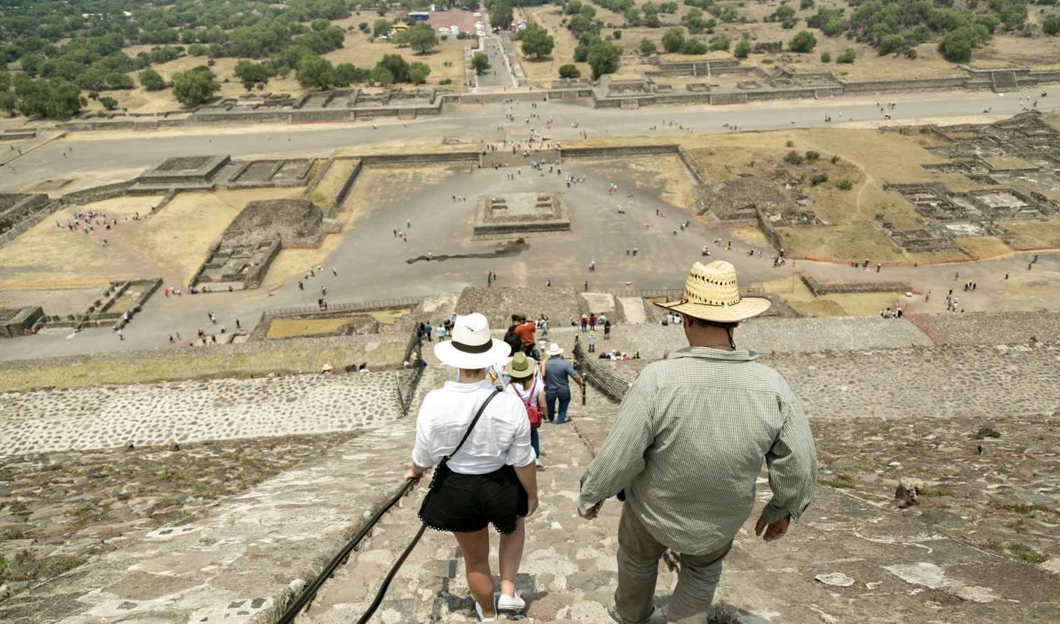 Visitors descend the Pyramid of the Sun at Teotihuacan, Mexico.