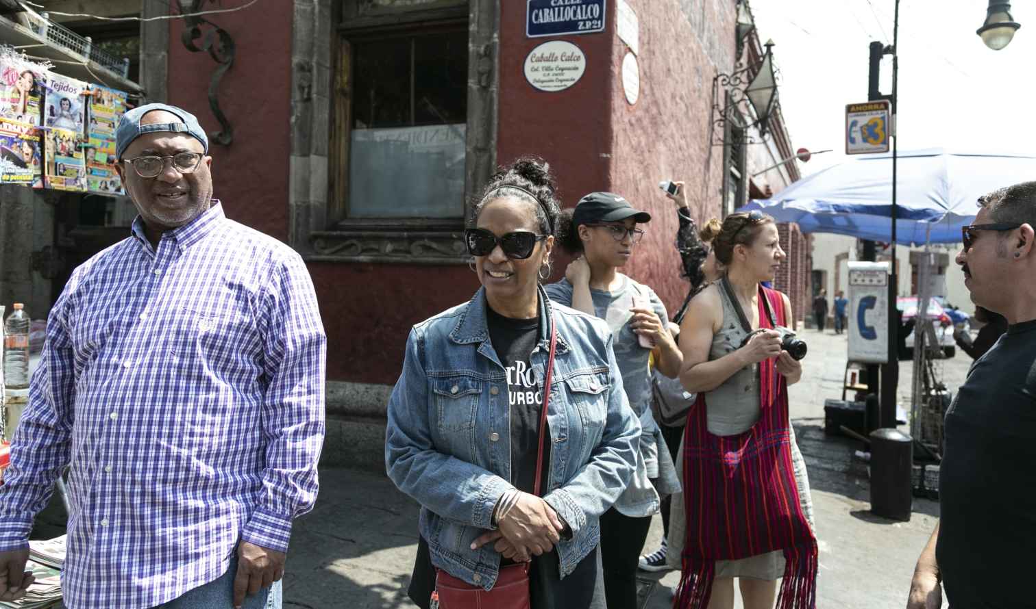 Group of people standing on Calle Caballocalco in Mexico City.