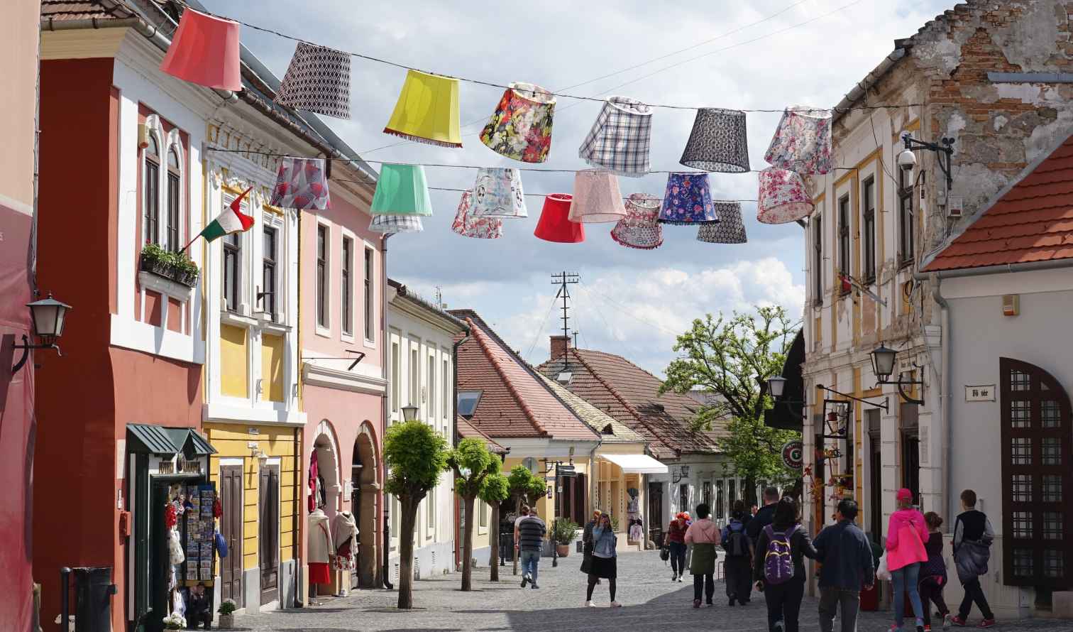 People walking down a street in Szentendre, Hungary.