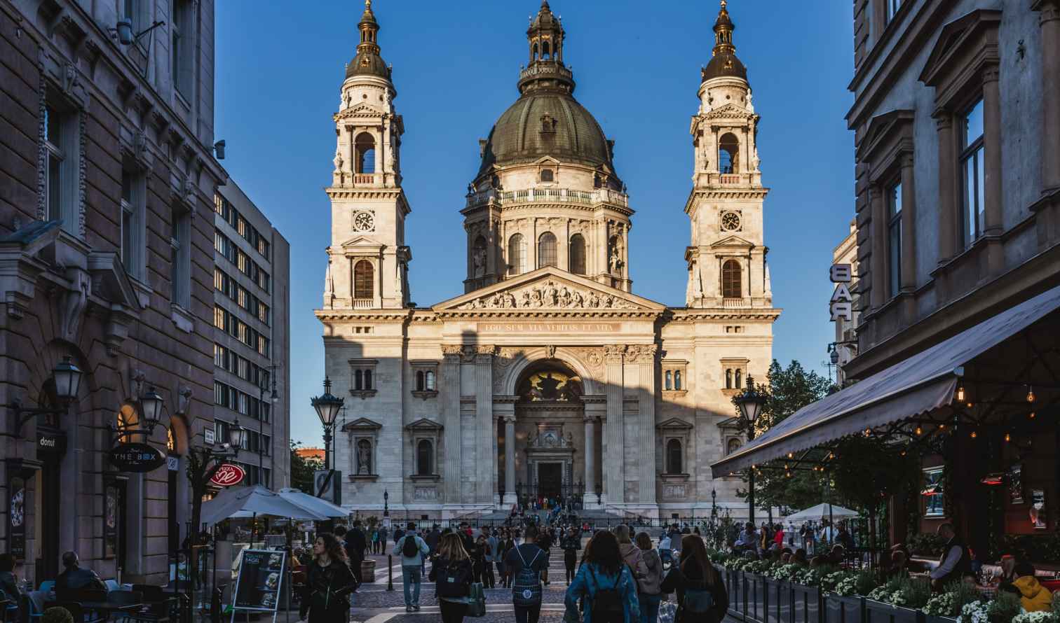 St. Stephen's Basilica in Budapest with people walking towards it.