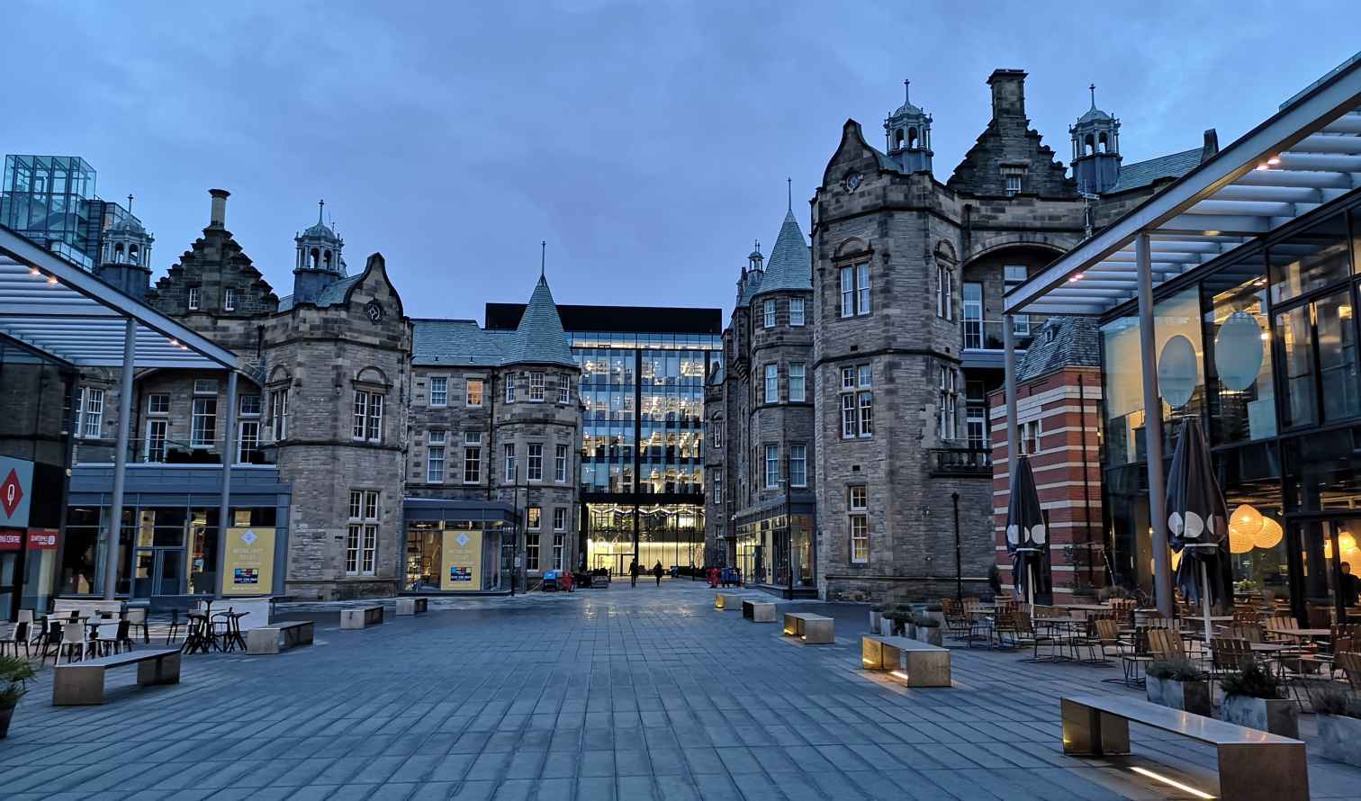 Edinburgh's Quartermile area with historic stone buildings and modern glass structures.