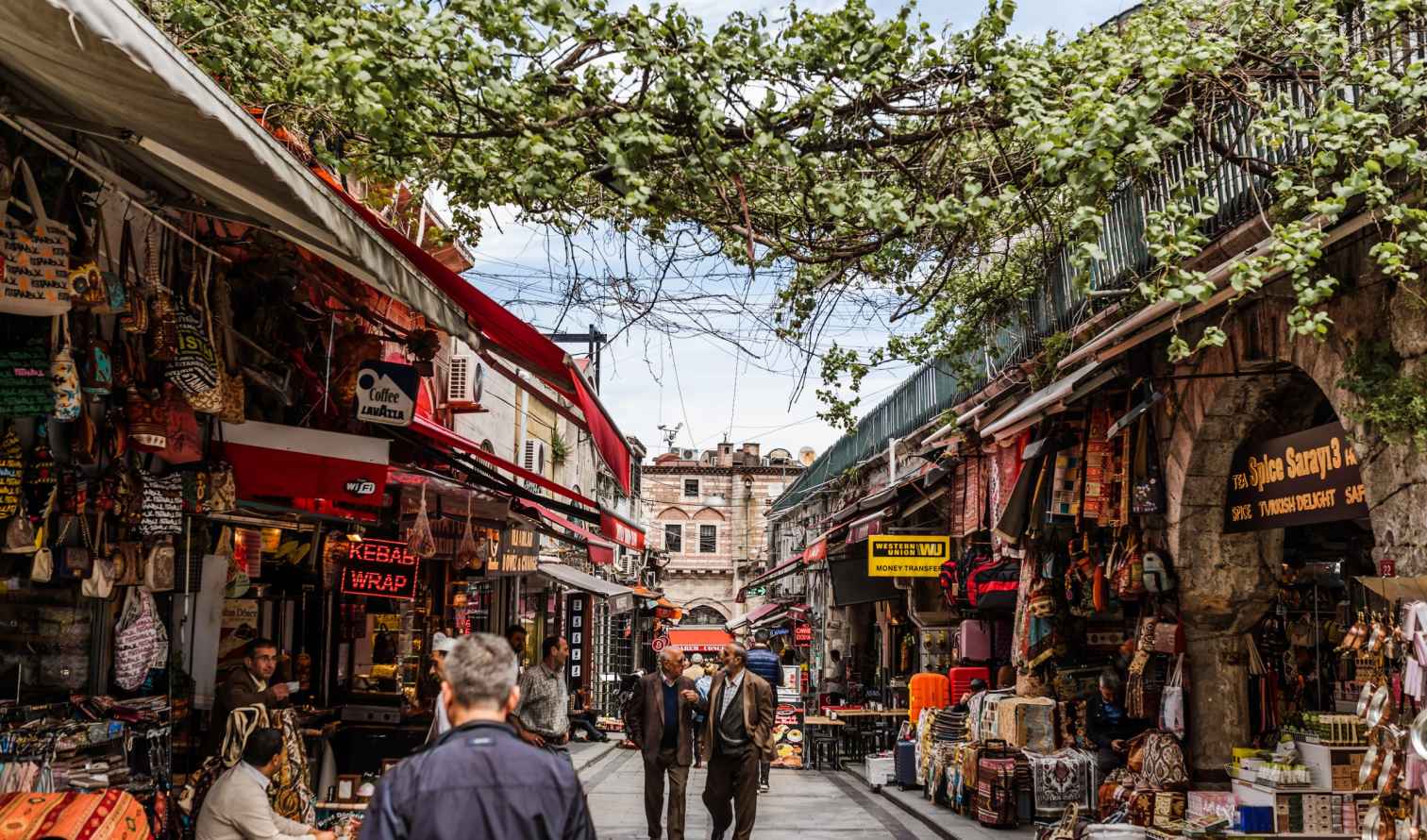 People walking through a busy street market in Istanbul, Turkey.