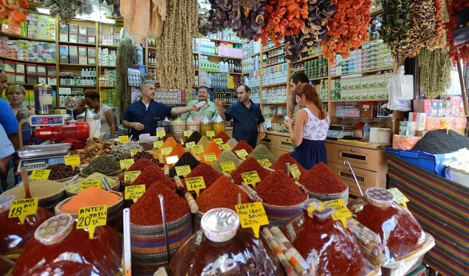 Inside the Grand Bazaar in Istanbul with spice stalls and vendors.