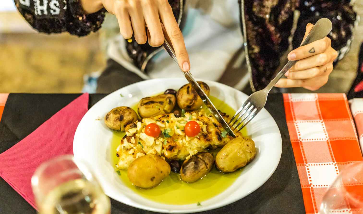 Close-up of bacalhau dish being enjoyed in a dining setting in Lisbon
