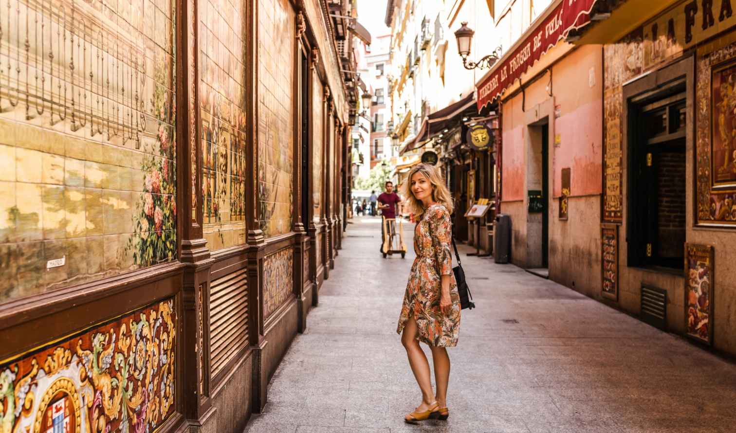 Street scene with decorative tile murals in Madrid, Spain.