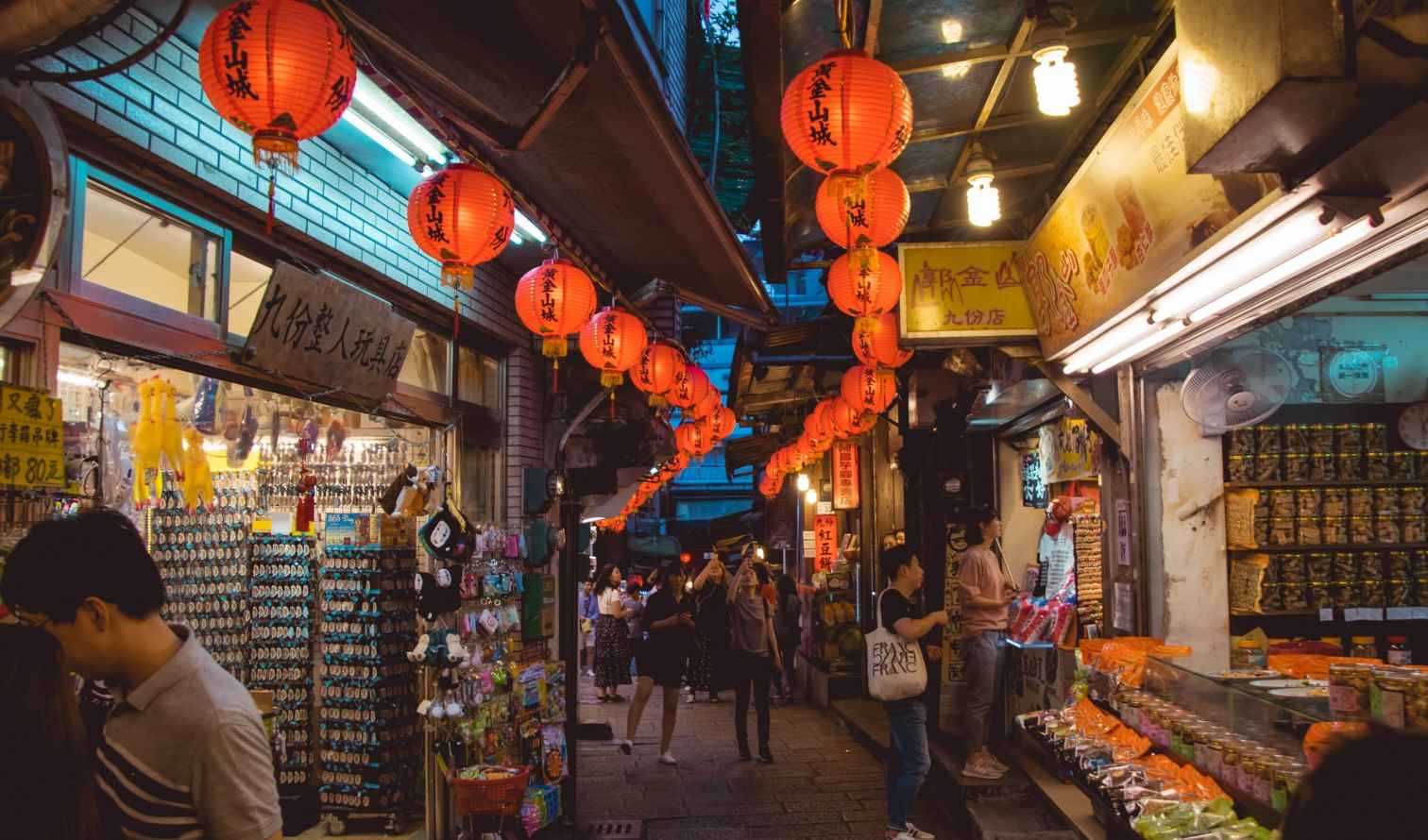 Street scene in Jiufen, Taiwan, with hanging red lanterns.
