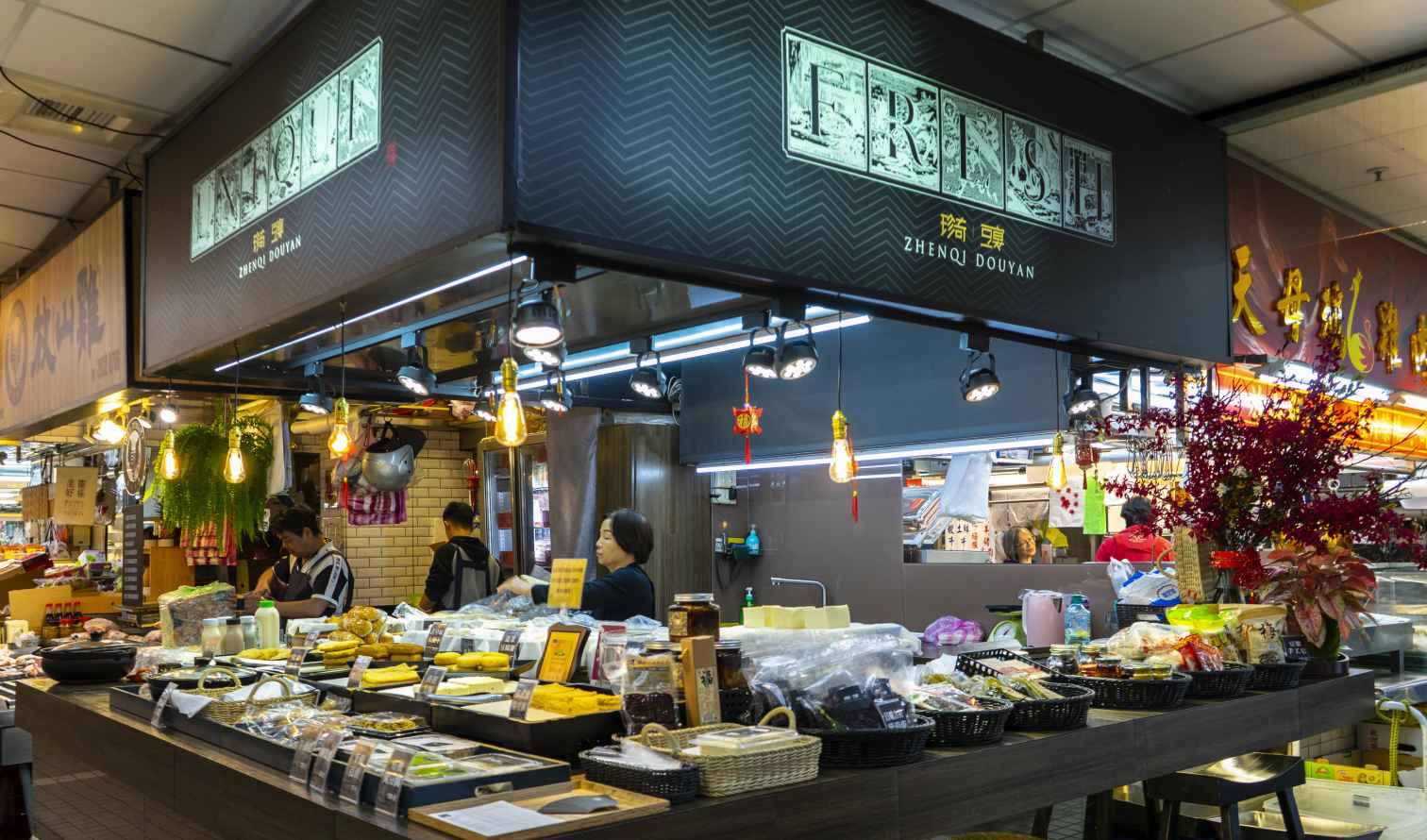 Zhenqi Douyan store featuring hanging lights and a counter with products in Taipei