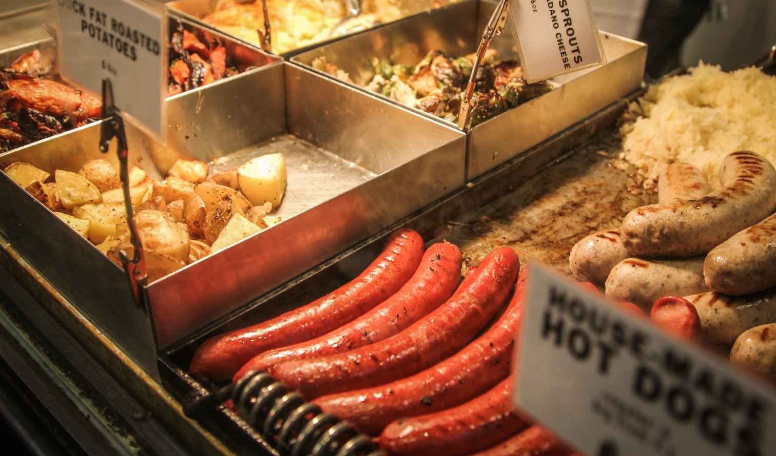 Hot dogs and sausages displayed at a food market stall in New York
