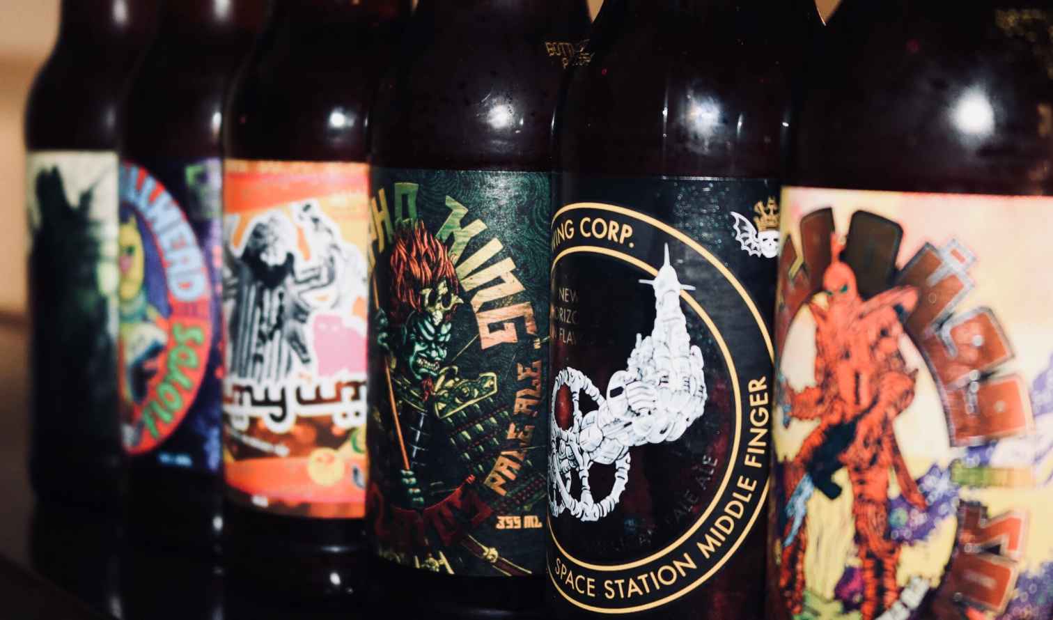 Close-up of five craft beer bottles with unique label designs in Melbourne