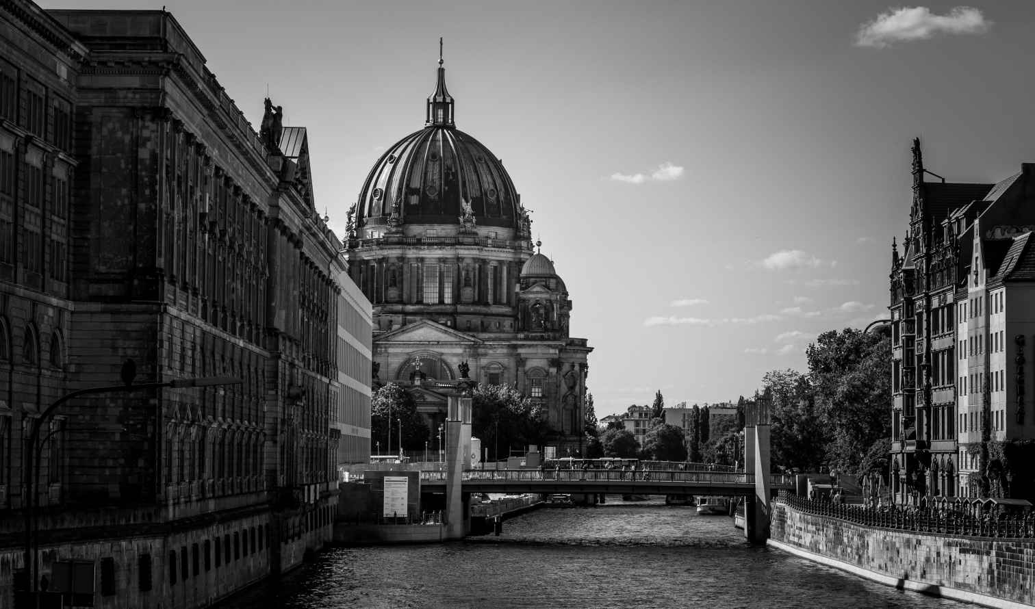 Berliner Dom visible from a river in Berlin, Germany.