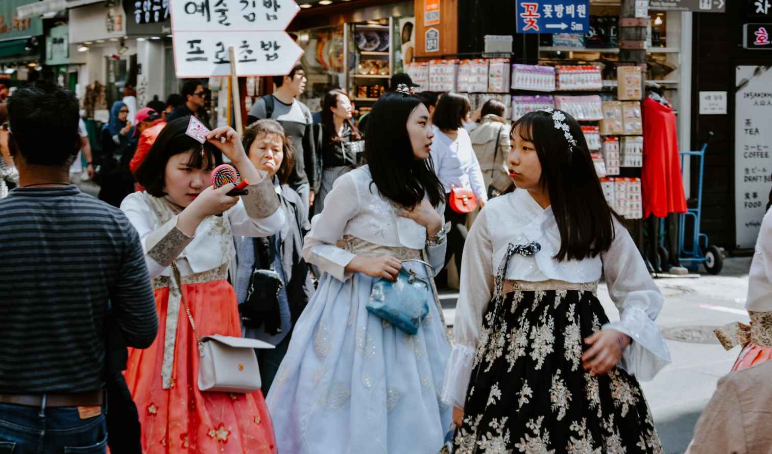People in traditional hanbok walking in Insadong, Seoul.