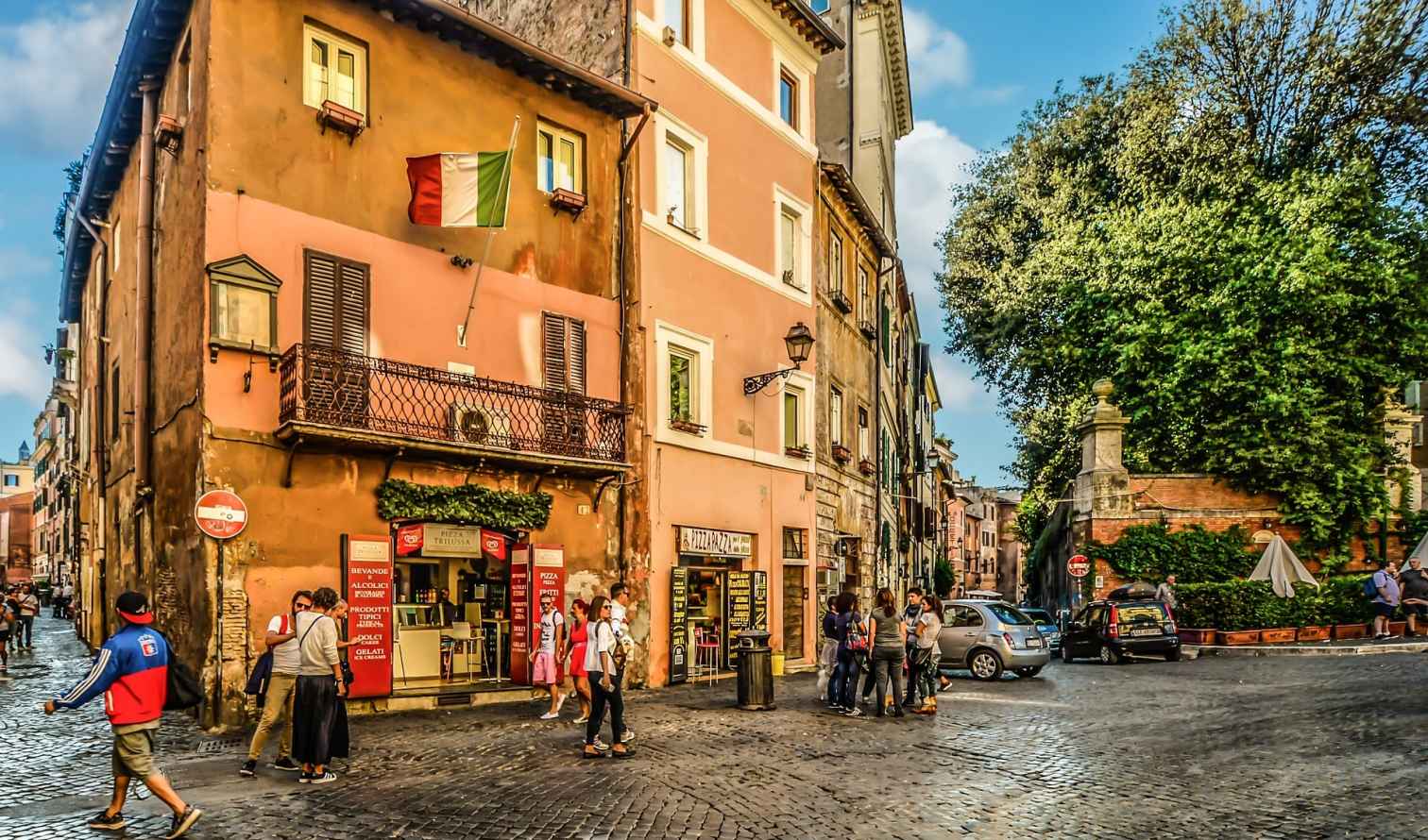 Street corner with Italian flag in Trastevere, Rome.
