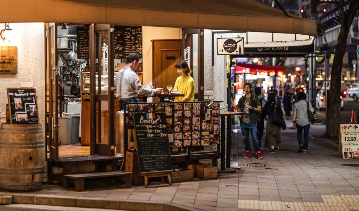 Restaurant entrance on a busy street in Kobe, Japan.