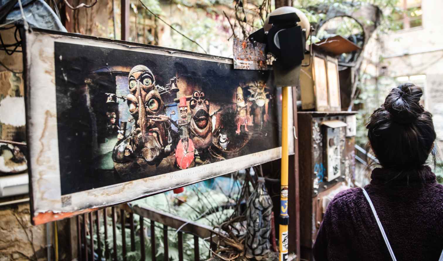 Person viewing art in a courtyard at Haus Schwarzenberg, Berlin.